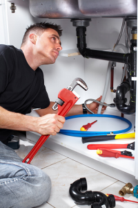 a plumber in Orange CA is replacing a drain line